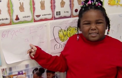 joyfully engage learning student in front of school work.